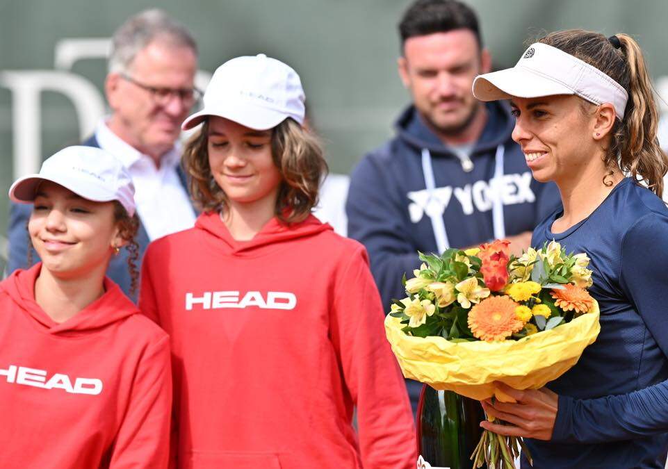 Player with bouquet and ball kids
